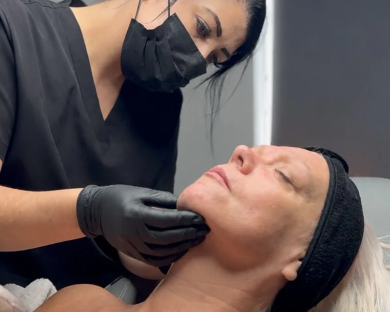Gemma assessing a client's skin at ClearSkin4u